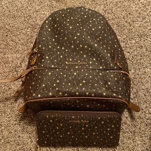 Michael kors brown with gold stars leather backpack with matching wallet.